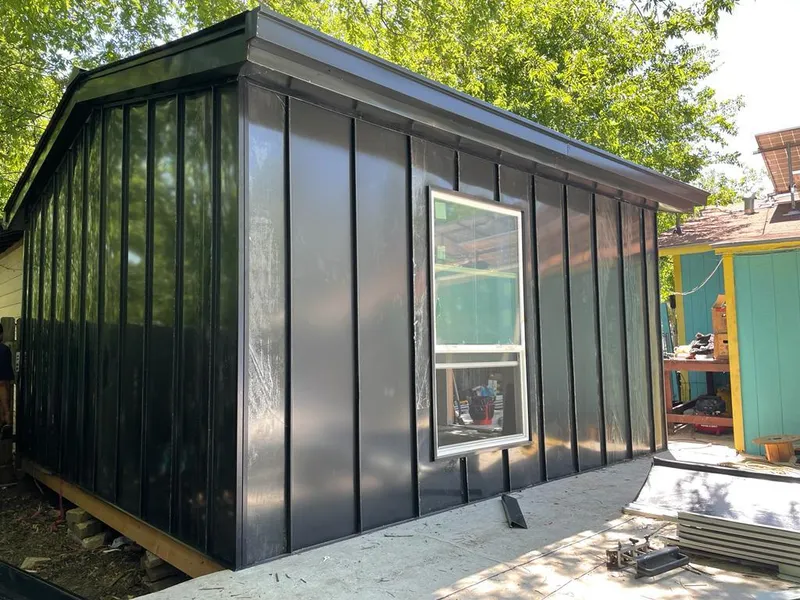 Black standing seam metal wall panels for Roof Inspection in Farmington